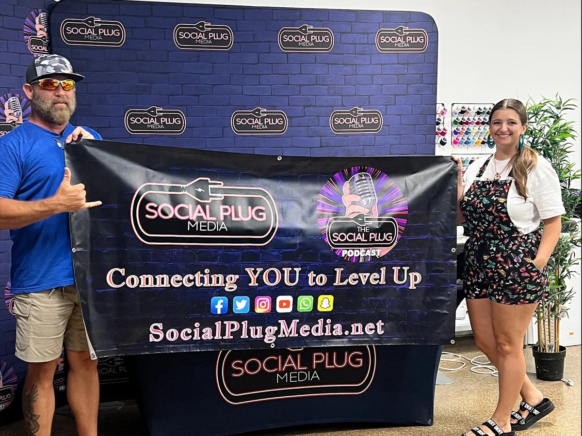 Social Plug Media trade show banner with brand ambassadors